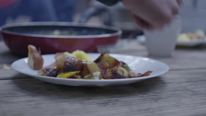 Food steaming on a picnic table