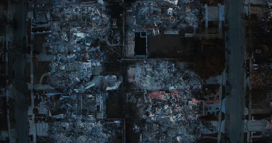 An aerial view reveals the extensive fire damage and devastation of destroyed buildings and ruins