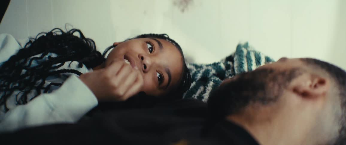 A daughter points at her father as they talk