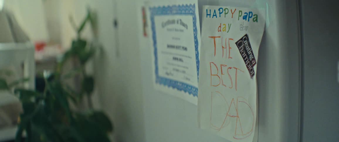 Tribute to fathers day drawn on a white sheet of paper stuck to a refrigerator