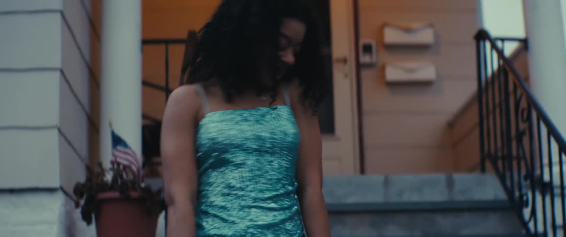 A girl models her dress and dances with her father