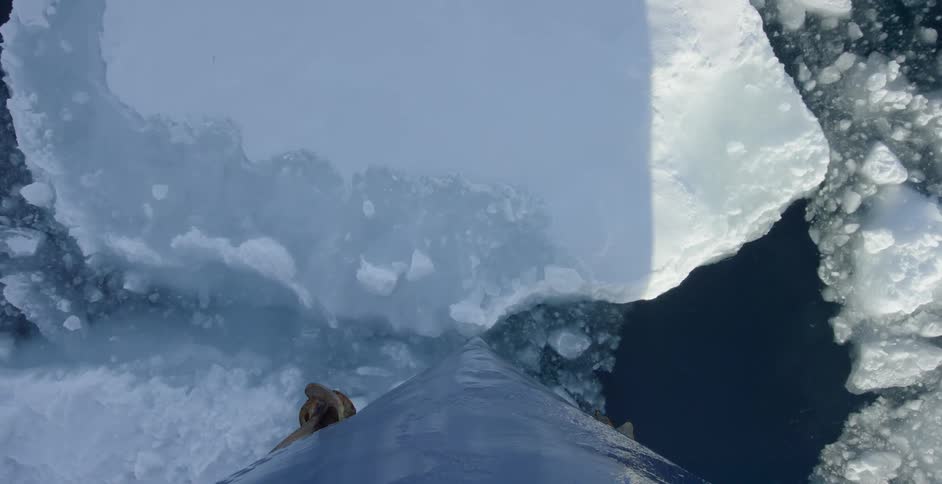 A boats hull pierces through the ice