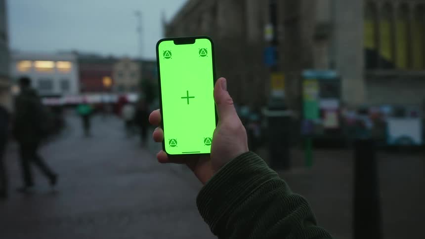 Hand holding an iphone and rotating it 360