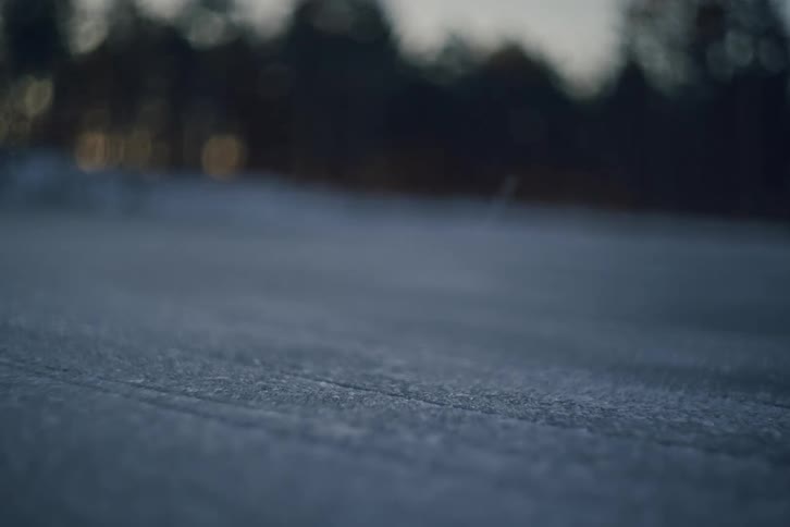 A hockey player skates in a circle on the ice