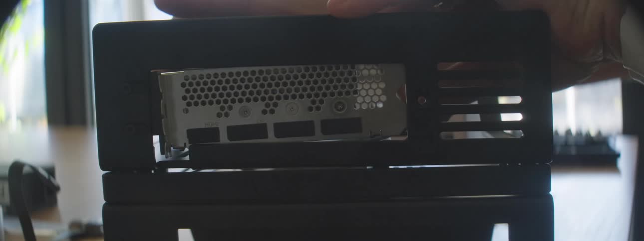 A person is building a computer with parts