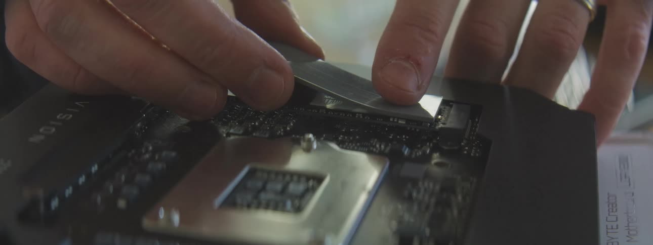 Person installs a ram memory module into a motherboard