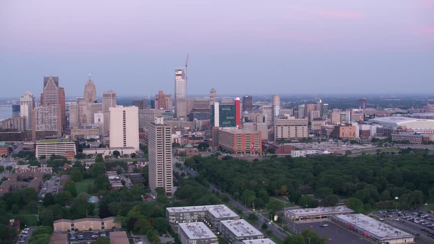 Aerial panorama of a metropolis with skyscrapers and an arena