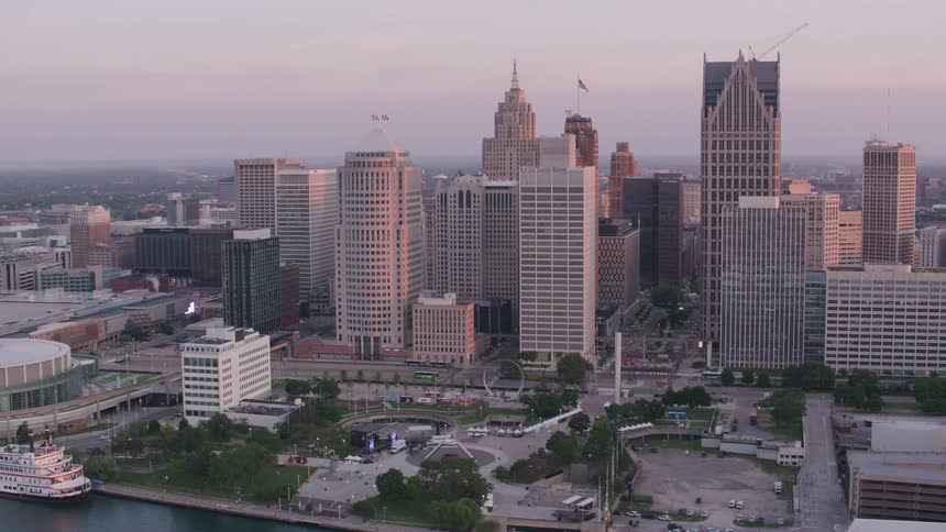An aerial view of a metropolitan city with some huge office buildings on a clear day
