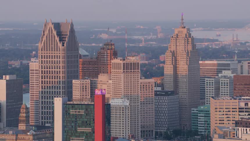 Skyscrapers reflect the golden light of dawn in the city center