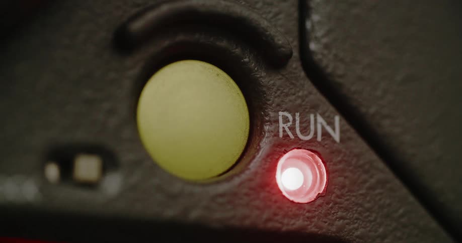 A person presses a button on the device