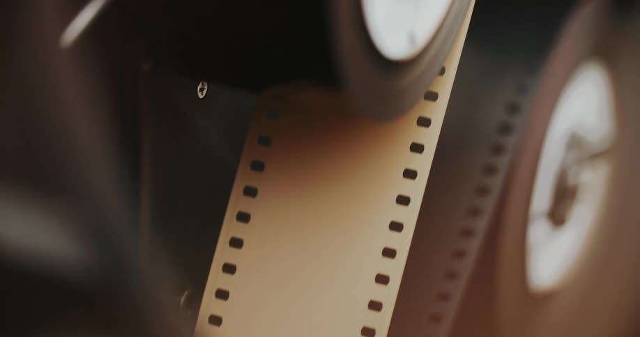 Close up of a film reel spinning on a spool