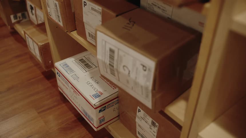 Boxes of goods organized in wooden cabinets