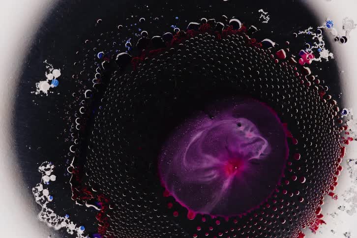 Extreme close up of an organic bubble bursting
