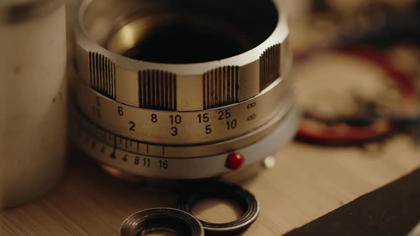 Closeup of parts of a disassembled camera on a table