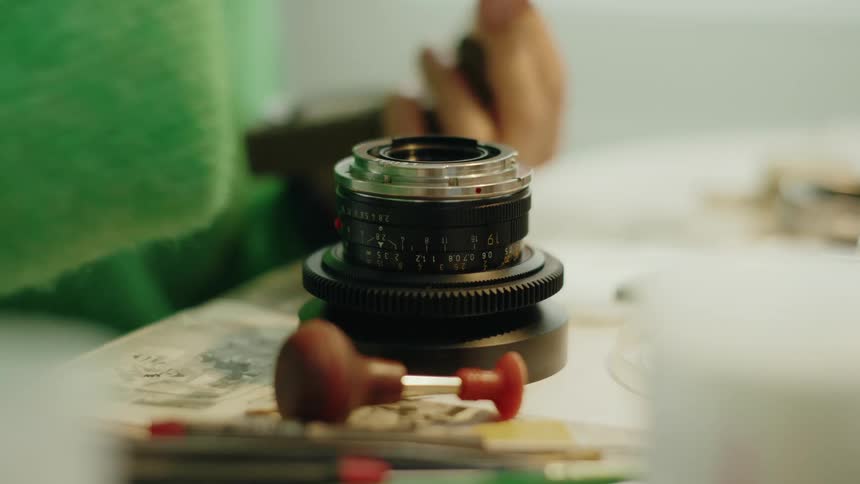 Pair of hands working with a camera accessory