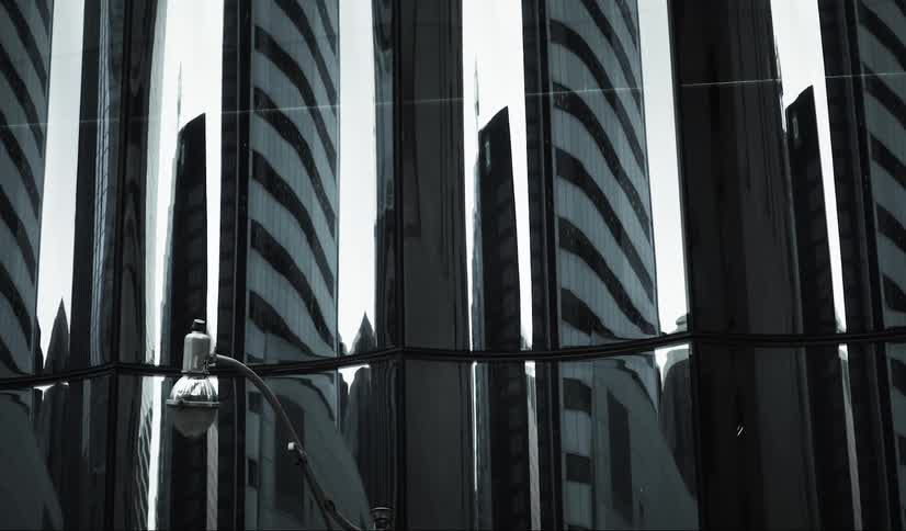 Modern skyscraper reflecting other buildings
