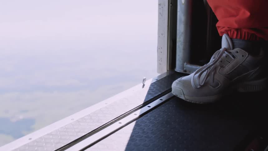 Persons foot next to an open airplane door