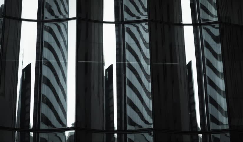 The windows on the building are reflective