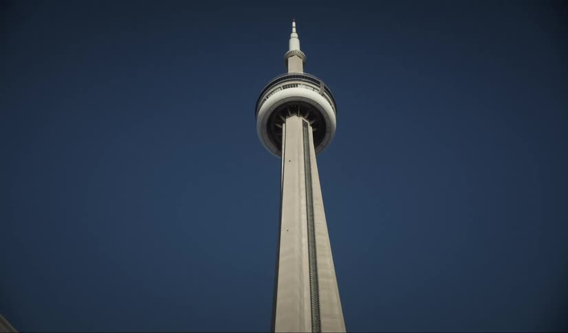 View up of cn tower against a blue sky