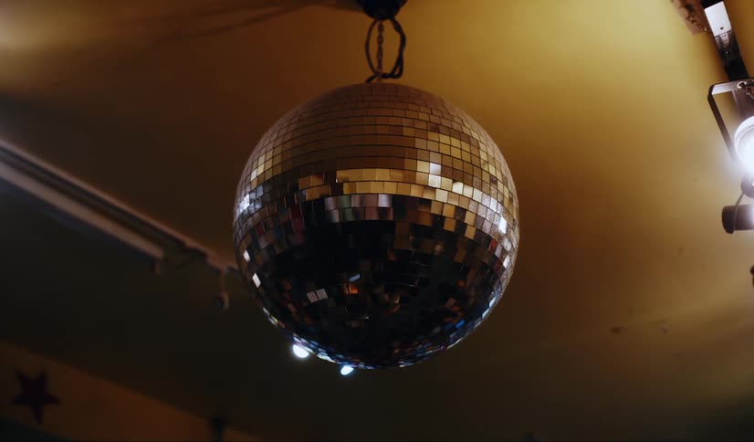 Shiny disco ball hanging from the ceiling