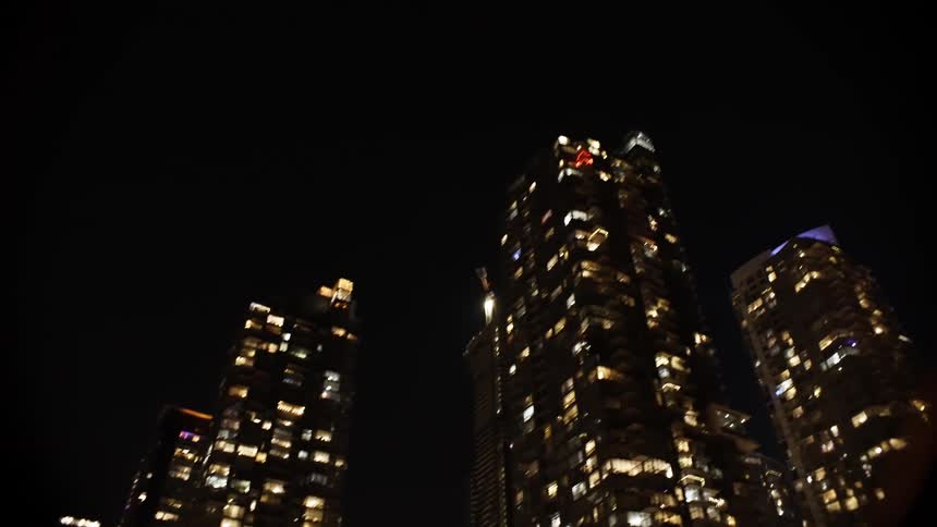 Upward view of modern skyscrapers at night