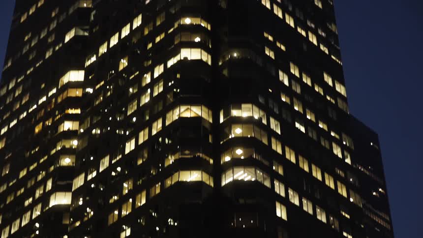 Tower of a building lit up at night