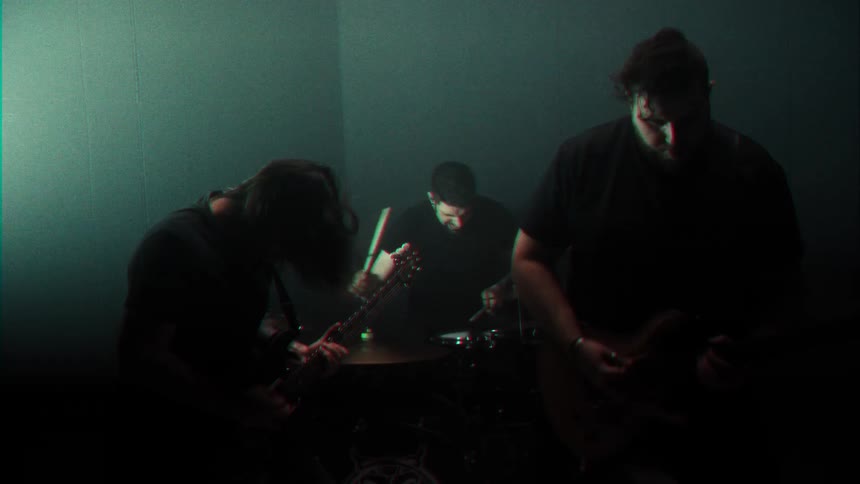 Rock music group playing guitar in a performance