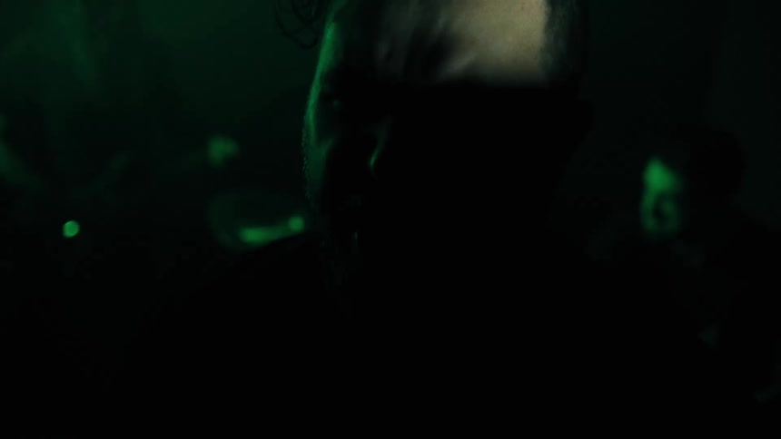 Portrait of a man singing vibrantly in a rock band performance