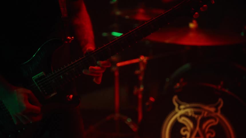 Band playing guitar and drums in a performance