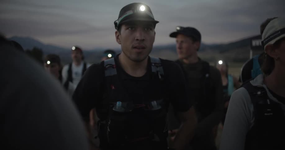 Group of mountain runners with headlamps concentrating