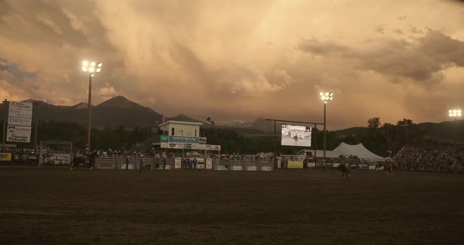 Crowd of people watching a rodeo