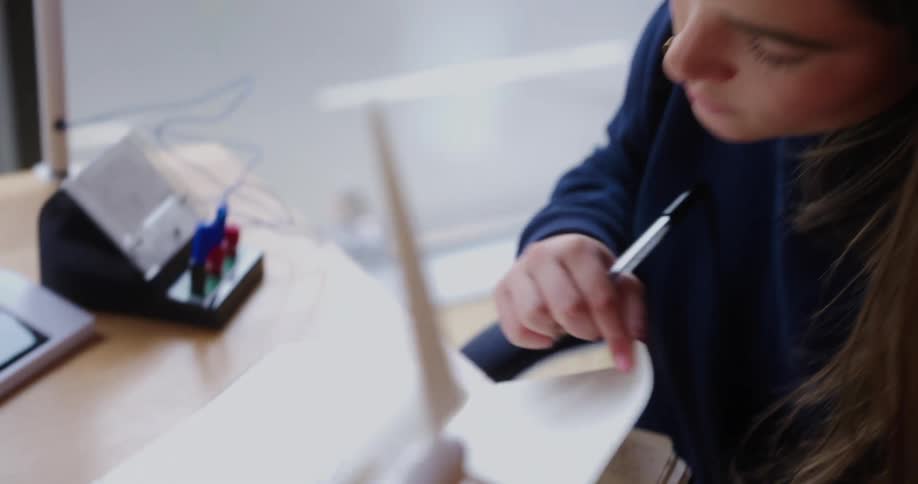 Woman writing in a notebook