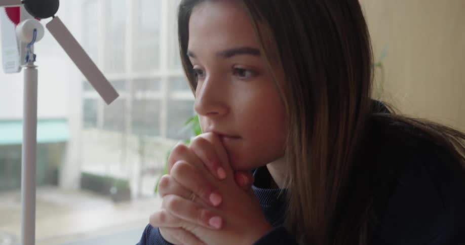 Young woman typing on a laptop