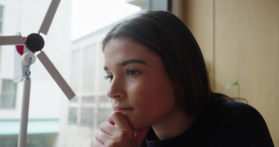 Young woman typing on a laptop