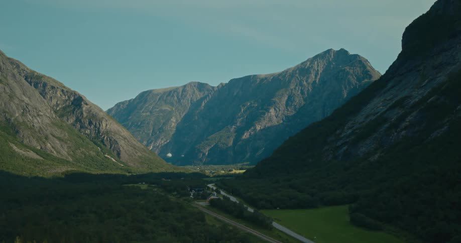 Aerial panorama of a mountain valley and houses in the background