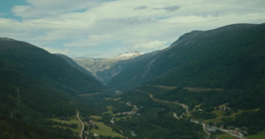 Aerial landscape of a mountain valley and houses in the background