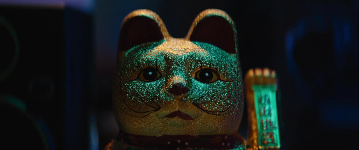 Close up of a golden asian ceramic lucky cat