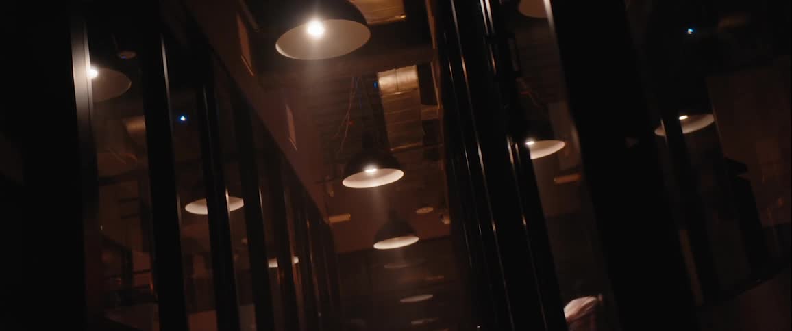 Person running through a mirrored hallway