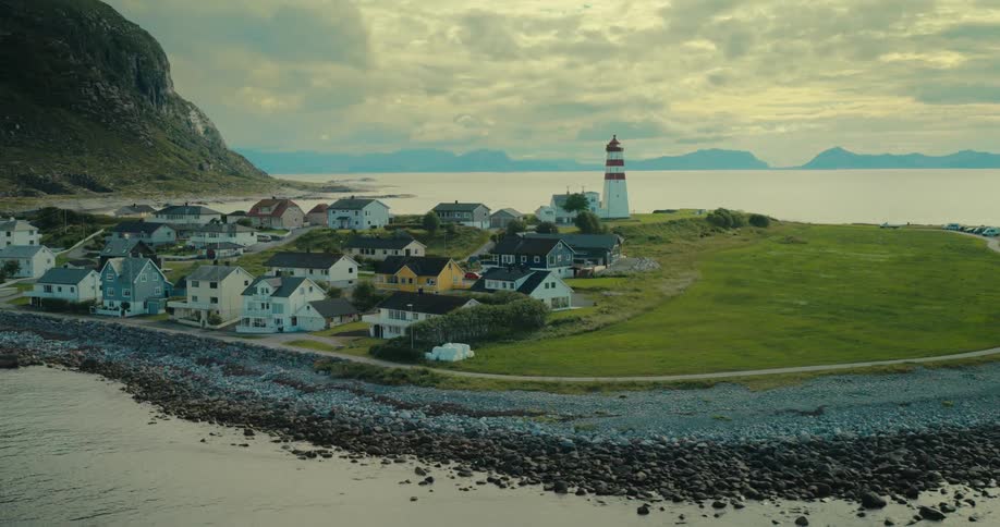 A coastal village with a lighthouse situated on alnes island