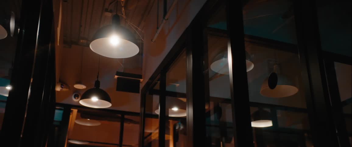 Lights in an office at night turning on