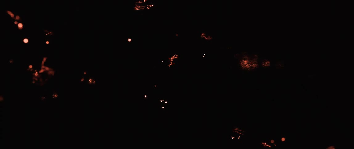 Sparks flowing across tendrils contrast with the darkness