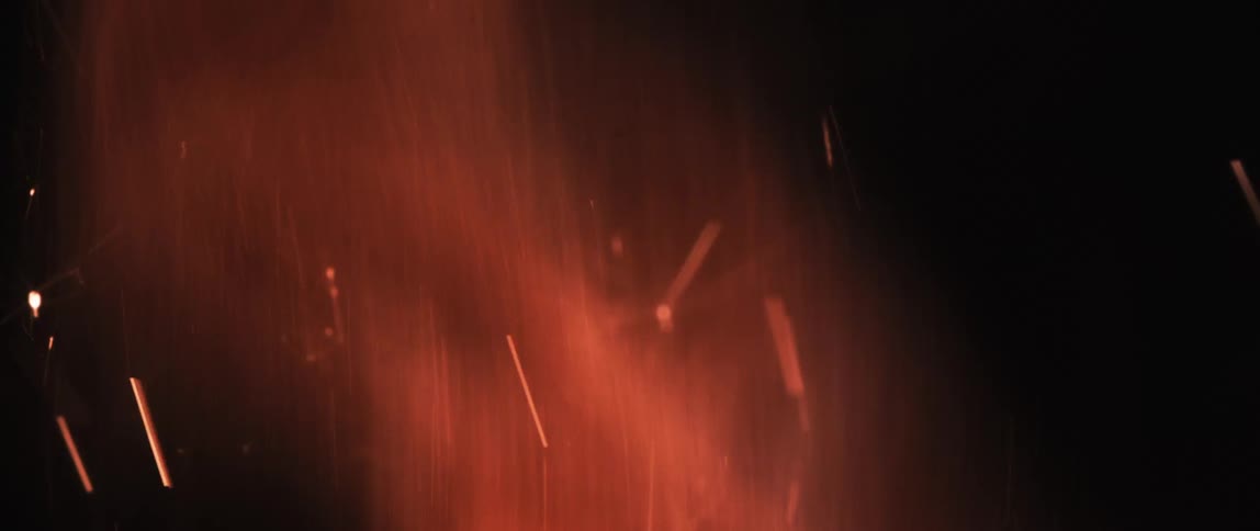 Smoke rises from a flame