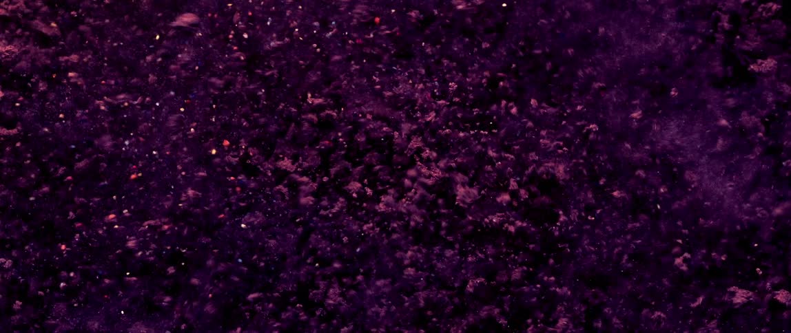 The soil explodes and blows all over