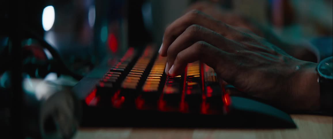 Pair of hands typing on a computer keyboard