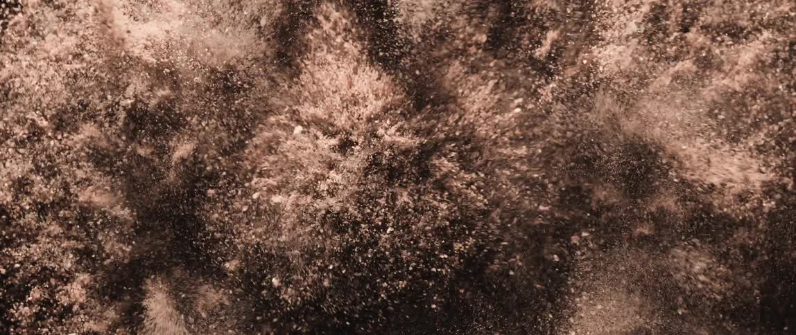 Abstract closeup on a brown colored powder shimmering