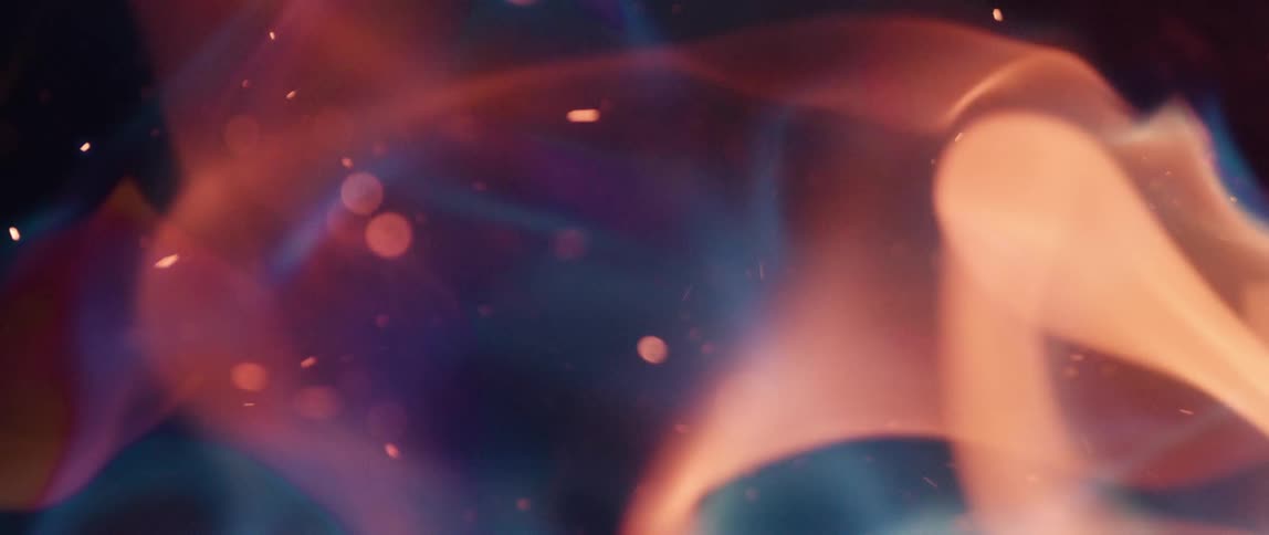 Flames of fire exuding against a dark background