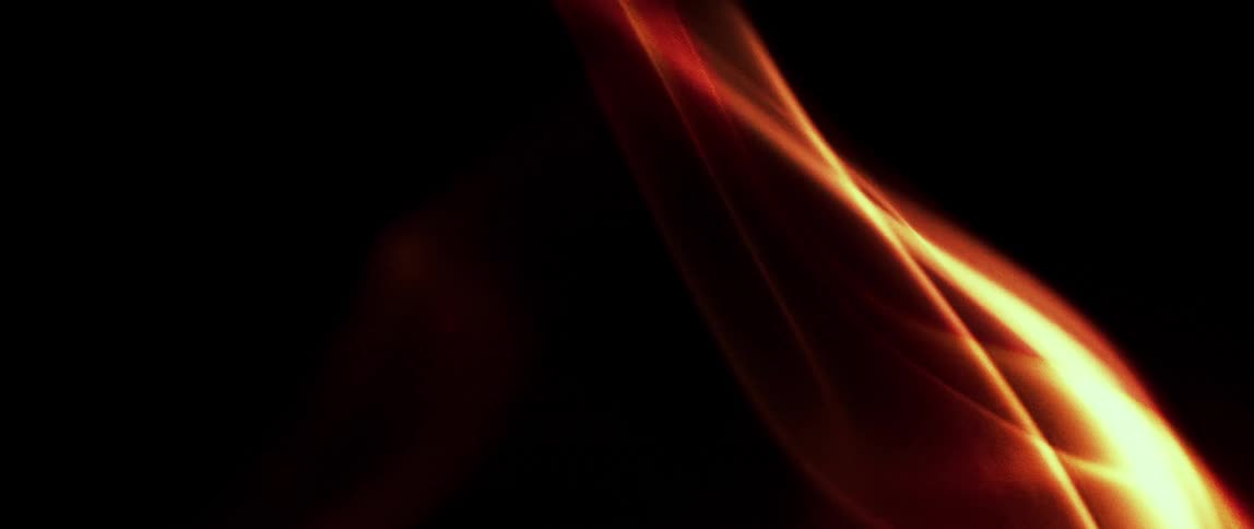 Close up of abstract fire flames against a black background