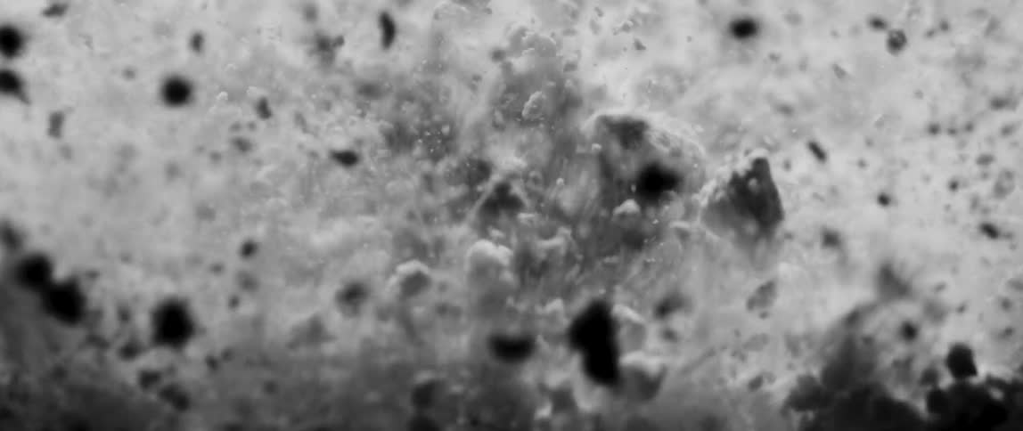 The dirt explodes and sprays all over