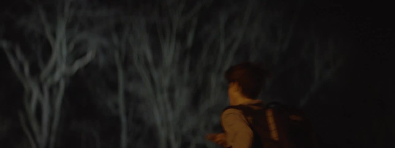 Boy running scared at night