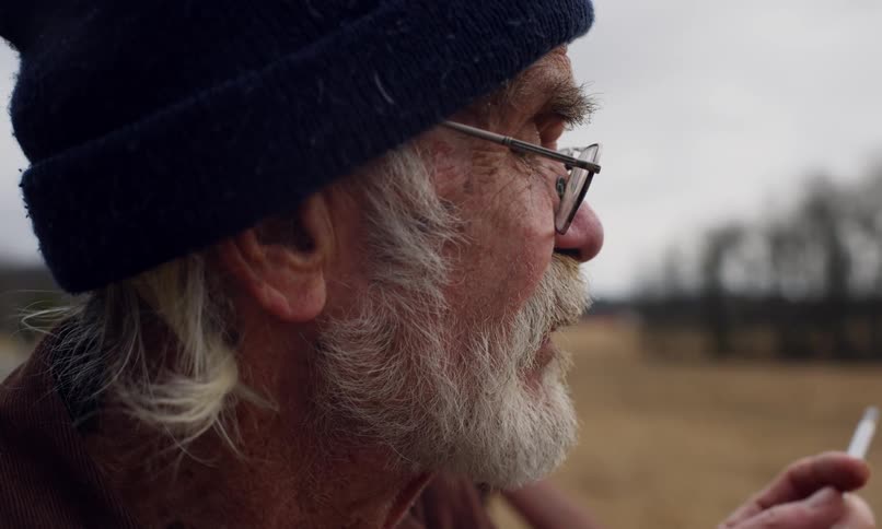 Side portrait of an elderly man smoking